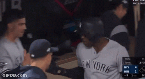 Man In Yankees Jersey Talking To Another Man GIF