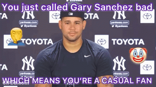 Man In Yankees Shirt In Front Of Toyota Ad GIF