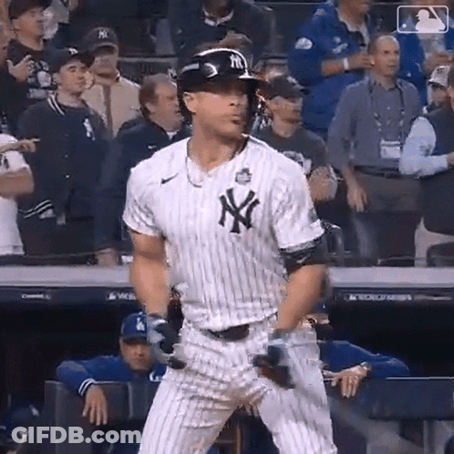 Man In Yankees Uniform Holding Bat GIF