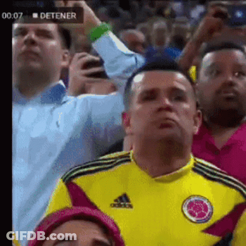 Man In Yellow Adidas Shirt Watching Soccer GIF