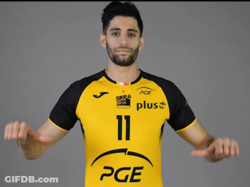 Man In Yellow And Black PGE Jersey GIF