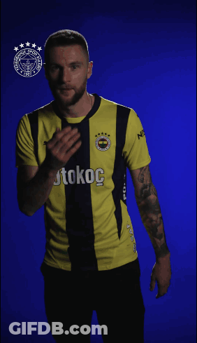 Man In Yellow And Black Shirt With Kokoc GIF