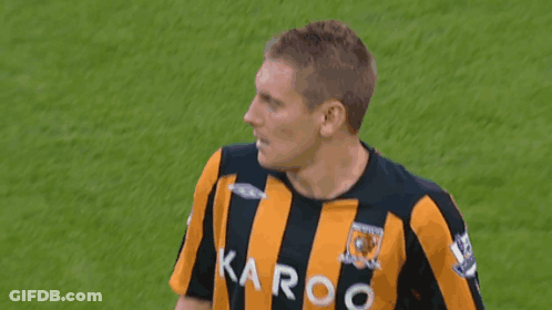 Man In Yellow And Black Striped Shirt With Karoo GIF