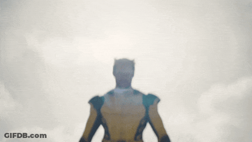 Man In Yellow And Black X-Men Costume GIF