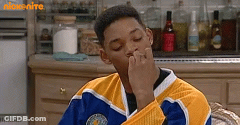 Man In Yellow And Blue Jersey Sitting Eyes Closed GIF