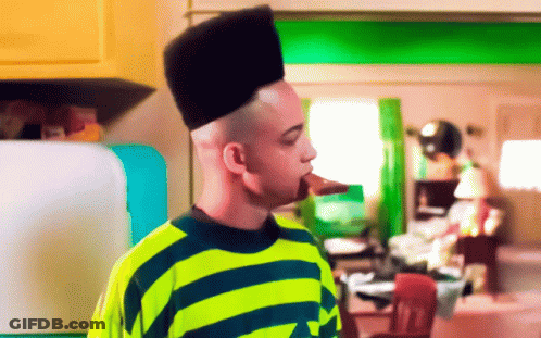 Man In Yellow And Blue Striped Shirt With High Hair GIF