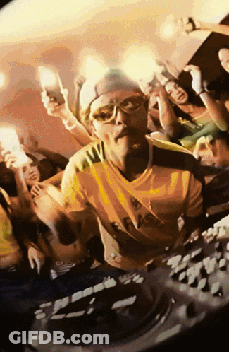 Man In Yellow And Green Shirt With A GIF