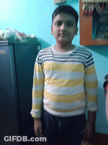 Man In Yellow And White Striped Shirt Standing By Fridge GIF