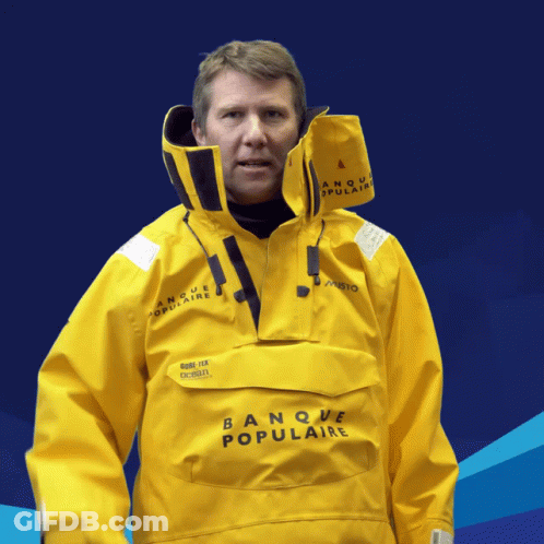 Man In Yellow Banque Populaire Jacket Blue Background GIF
