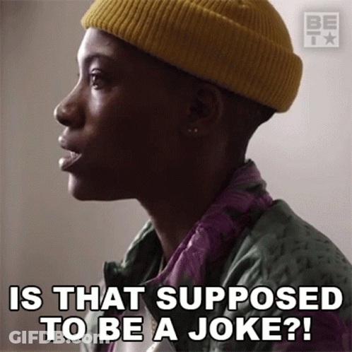 Man In Yellow Beanie And Green Jacket Says Is That Supposed To Be A Joke GIF
