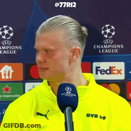 Man In Yellow BVB Shirt Talking Into Microphone GIF