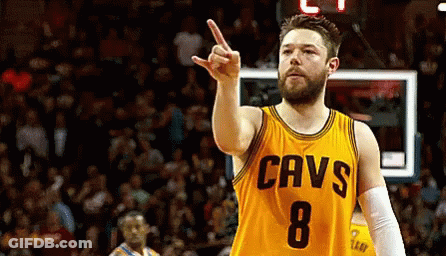 Man In Yellow Cavs Jersey Pointing Up GIF