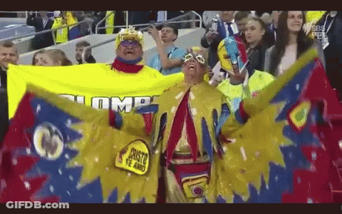 Man In Yellow Costume With Trump Flag GIF