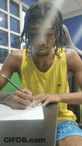 Man In Yellow Crown Tank Top Writing GIF