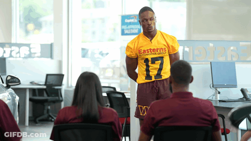 Man In Yellow Eastern Automotive Group Shirt GIF
