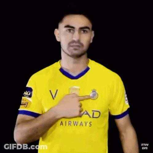 Man In Yellow Etihad Airways Jersey Waving GIF