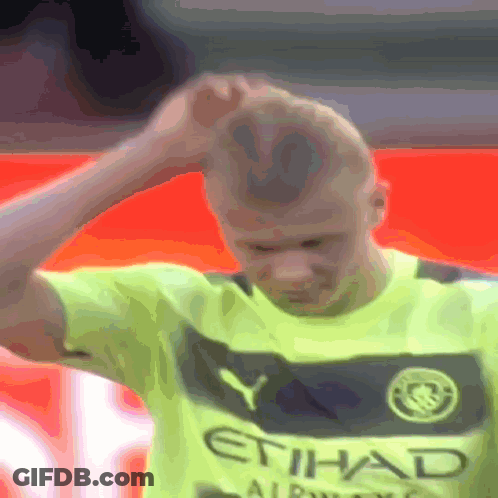 Man In Yellow Etihad Shirt Holds Head GIF