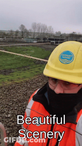 Man In Yellow Hard Hat Beautiful Scenery GIF