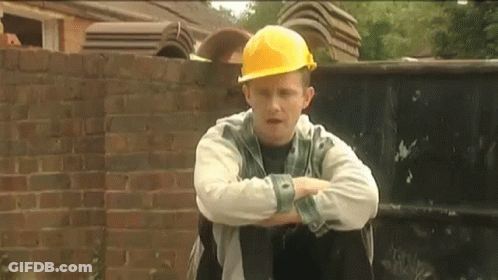 Man In Yellow Hard Hat Sitting Arms Crossed GIF