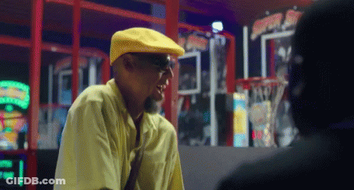 Man In Yellow Hat Talking To Man GIF