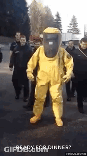 Man In Yellow Hazmat Suit Walking GIF