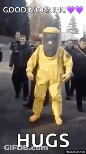 Man In Yellow Hazmat Suit Walking GIF