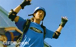 Man In Yellow Helmet Looking At Man In Purple Helmet GIF
