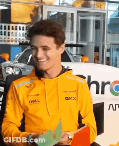 Man In Yellow Hoodie Holding Paper GIF