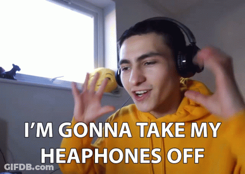Man In Yellow Hoodie Taking Off Headphones GIF