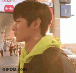 Man In Yellow Hoodie With Eastar Jet Sign GIF