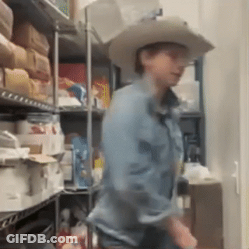 Man In Yellow Jacket And Blue Shirt GIF