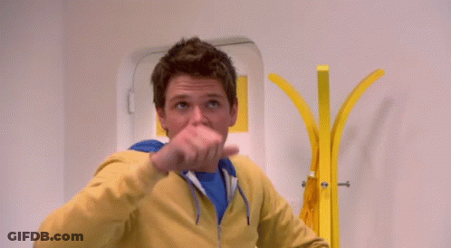 Man In Yellow Jacket And Blue Shirt GIF