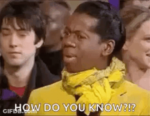 Man In Yellow Jacket And Scarf Before Crowd GIF