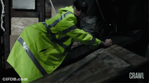 Man In Yellow Jacket Crawling GIF