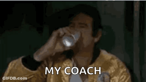 Man In Yellow Jacket Drinking Water Saying My Coach GIF