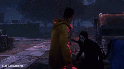 Man In Yellow Jacket Holding Red First Aid Kit Next To Scream GIF