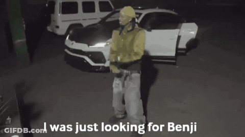 Man In Yellow Jacket In Front Of White Car Says I Was Just Looking For Benji GIF