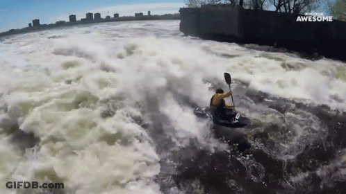 Man In Yellow Jacket Kayaking Saying Awesome GIF