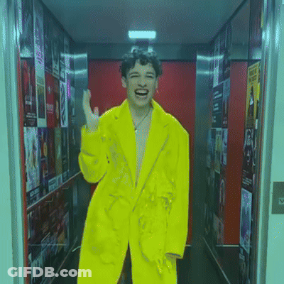 Man In Yellow Jacket Laughing GIF