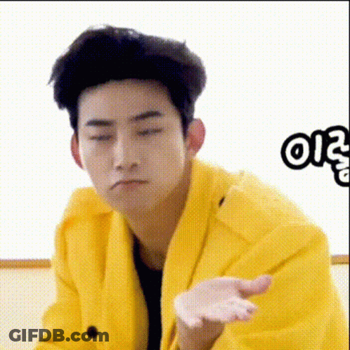Man In Yellow Jacket Making Funny Face GIF