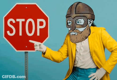 Man In Yellow Jacket Pointing At Stop Sign GIF
