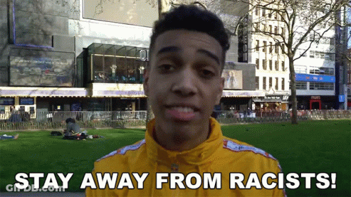 Man In Yellow Jacket Says Stay Away From Racists GIF
