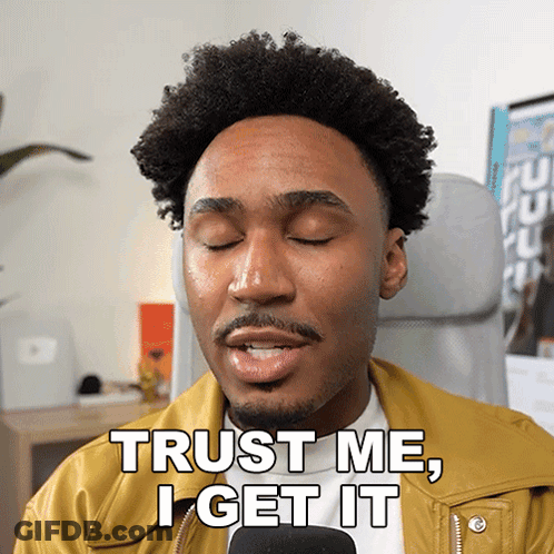 Man In Yellow Jacket Says Trust Me I Get It Into Microphone GIF