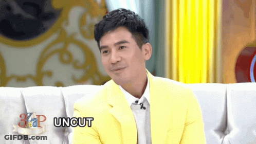 Man In Yellow Jacket Sitting On Couch Saying Uncut GIF