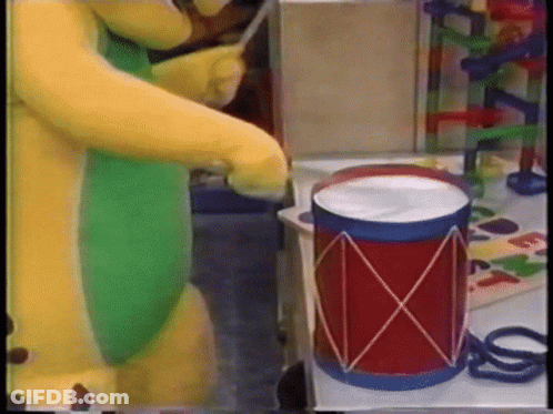 Man In Yellow Jacket Smiling With Arms Up GIF