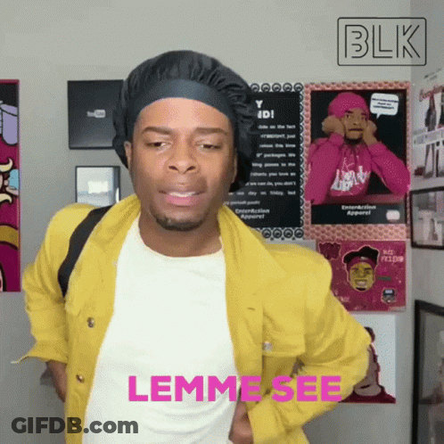 Man In Yellow Jacket Standing By Blk Sign GIF