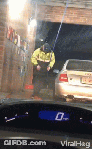 Man In Yellow Jacket Washing Car, Speedometer 0 Mph GIF