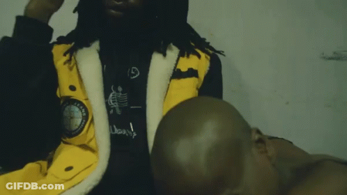 Man In Yellow Jacket With Compass GIF