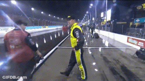 Man In Yellow Jacket With Shell On Pants GIF