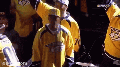 Man In Yellow Jersey 76 At Microphone GIF